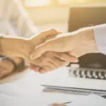 Lawyer reviewing legal documents with a client, representing professional legal services and consultation.