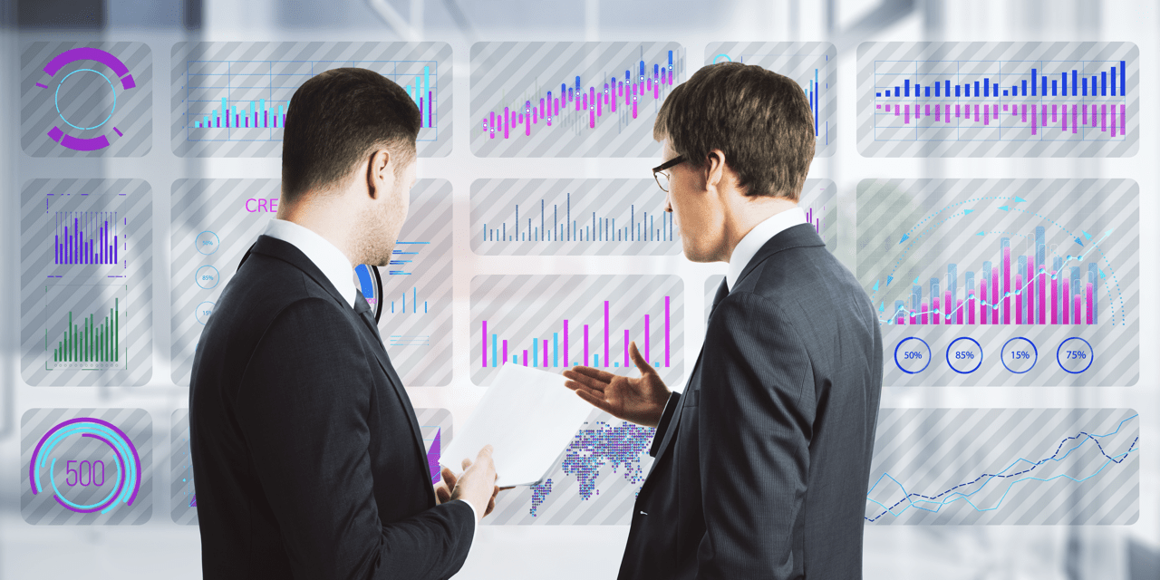 Business professional in modern office analyzing lead generation data on a digital screen