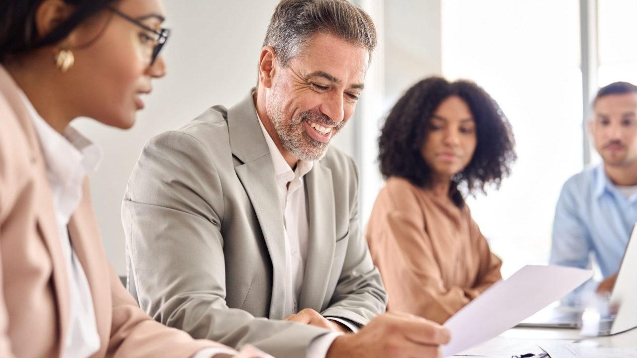 A successful attorney reviewing financial projections and lead reports in a modern office, representing lawyers scaling to $500K+ in income.