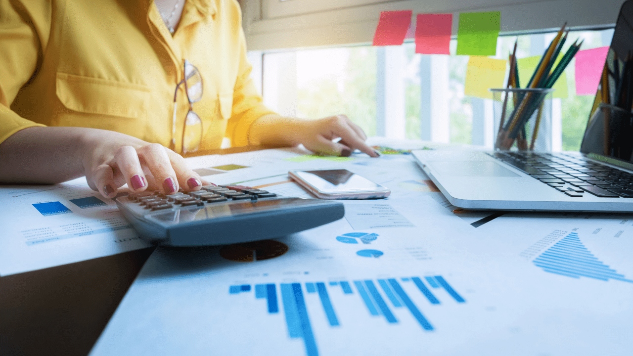 A lawyer sitting at a modern desk reviewing digital lead reports and evaluating a paid legal lead generation service.