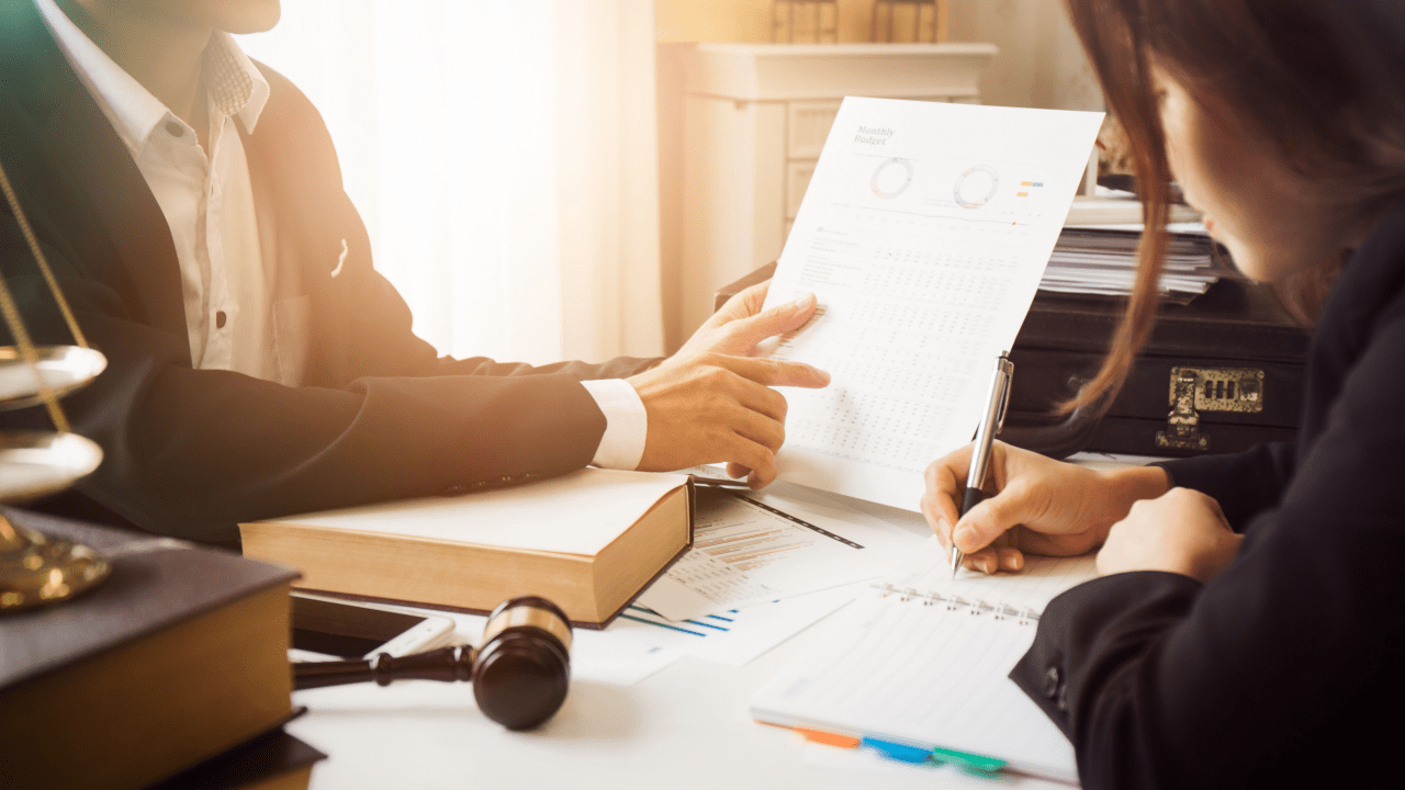 Attorney reviewing legal lead pricing breakdown and ROI metrics on a laptop, representing cost per lead evaluation.