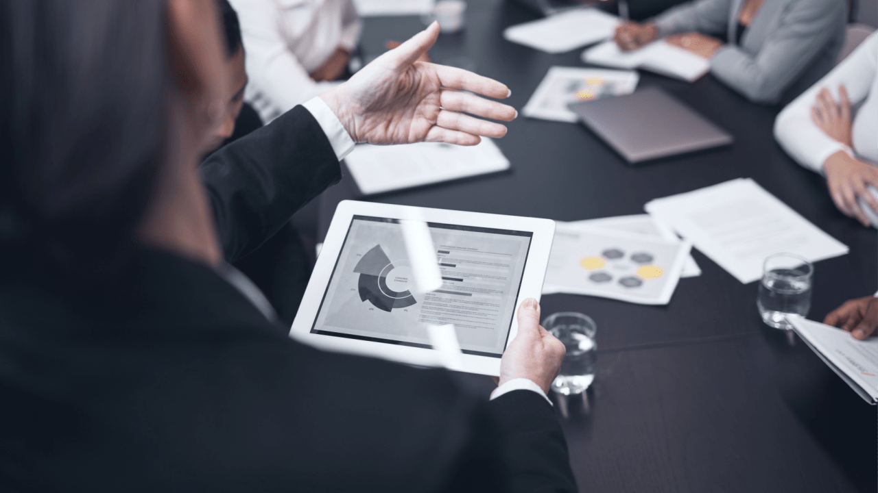 Law firm team reviewing digital marketing dashboard to evaluate purchased legal leads