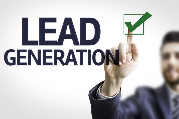 Businessman pointing at a checkmark with the words Lead Generation
