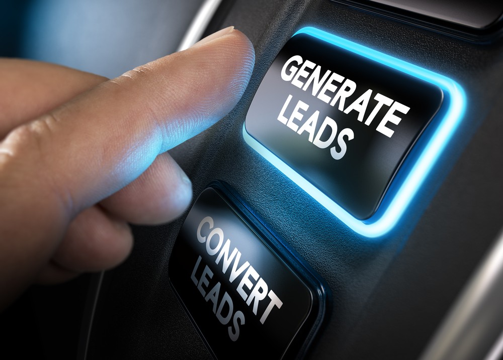 Finger pressing a glowing “Generate Leads” button next to “Convert Leads” option