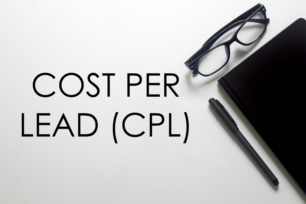 Cost Per Lead (CPL) text with glasses, pen, and notebook