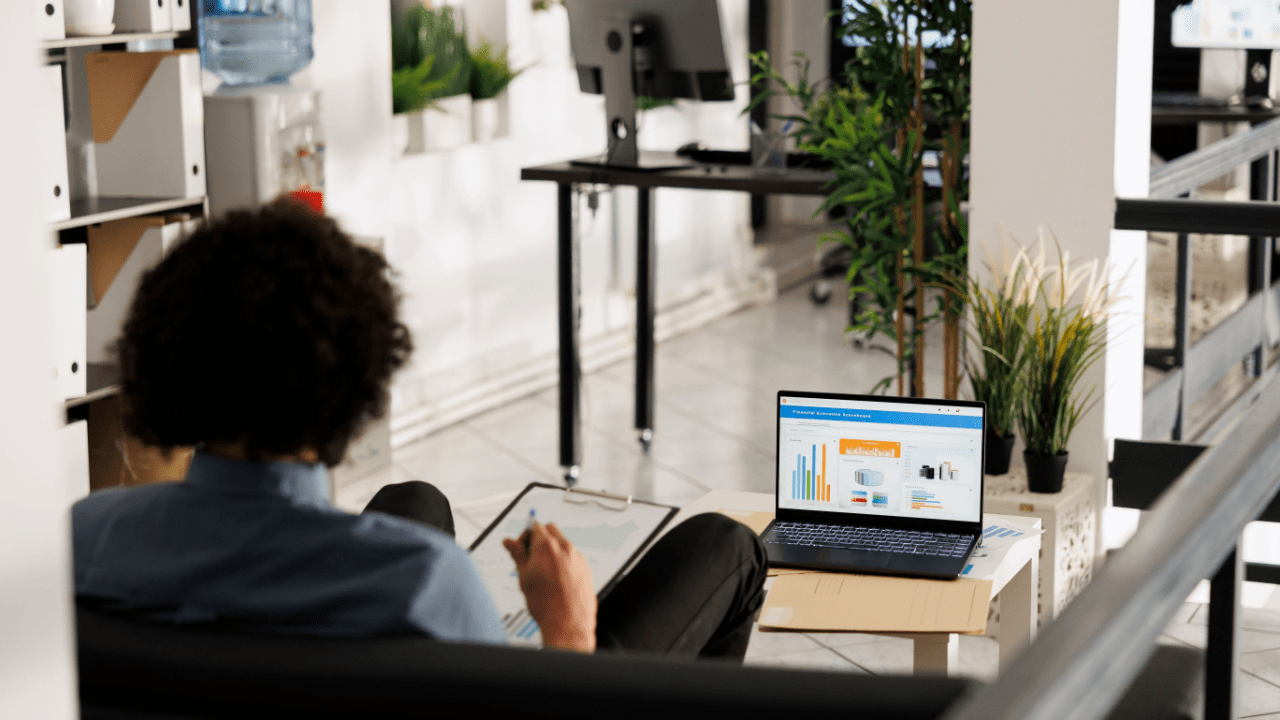 Professional analyzing lead generation pricing strategies with digital marketing metrics on screen.