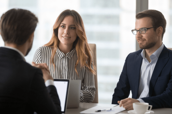 Legal marketing team discussing effective marketing strategies for bankruptcy lawyers in corporate meeting