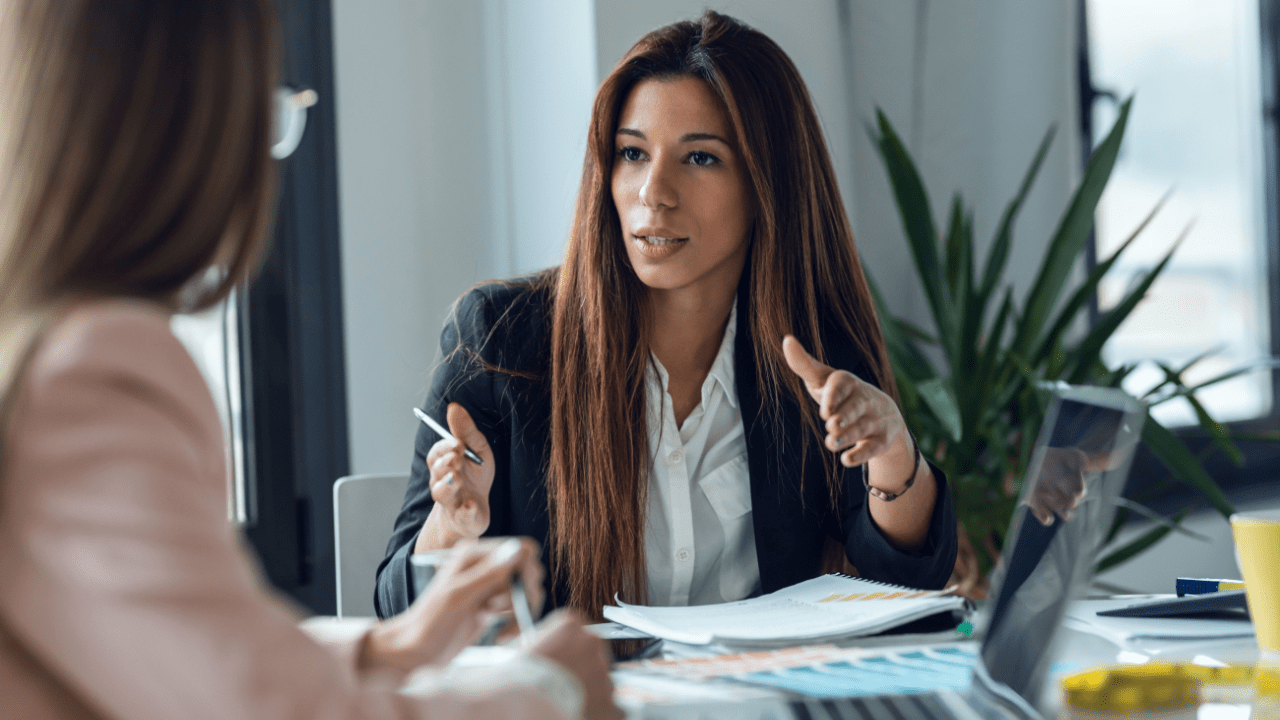 Business professional conducting bankruptcy lead pricing comparison discussion with client in modern office