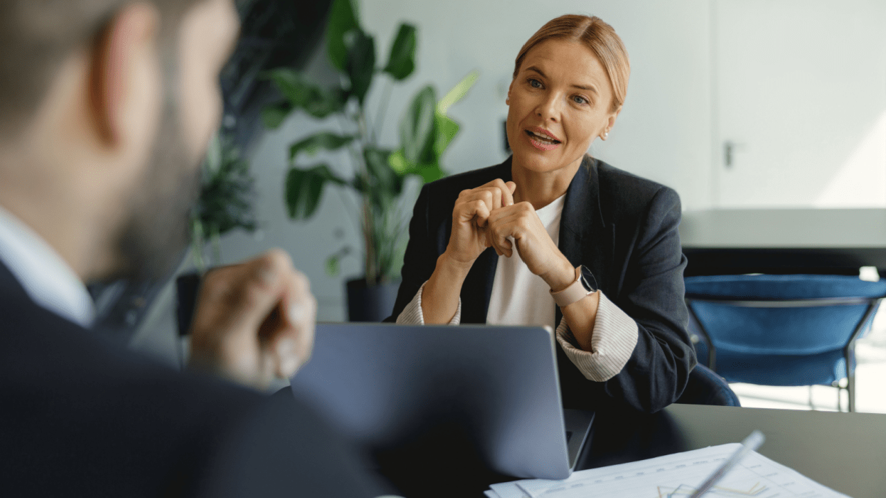 Business consultant advising attorney on how to generate bankruptcy attorney leads in professional office setting